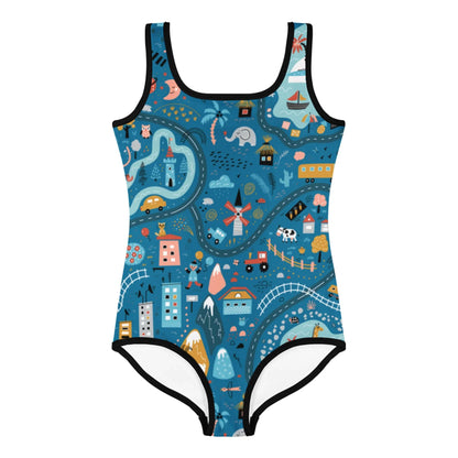 One-piece Mambí swimsuit with a whimsical map print featuring rivers, roads, houses, boats, trees, animals, mountains, and playful icons in vibrant colors on a dark blue background.
