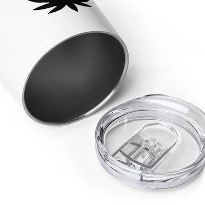 A close-up of a Mambí stainless steel tumbler with a white exterior and a transparent plastic lid placed next to it on a white background.