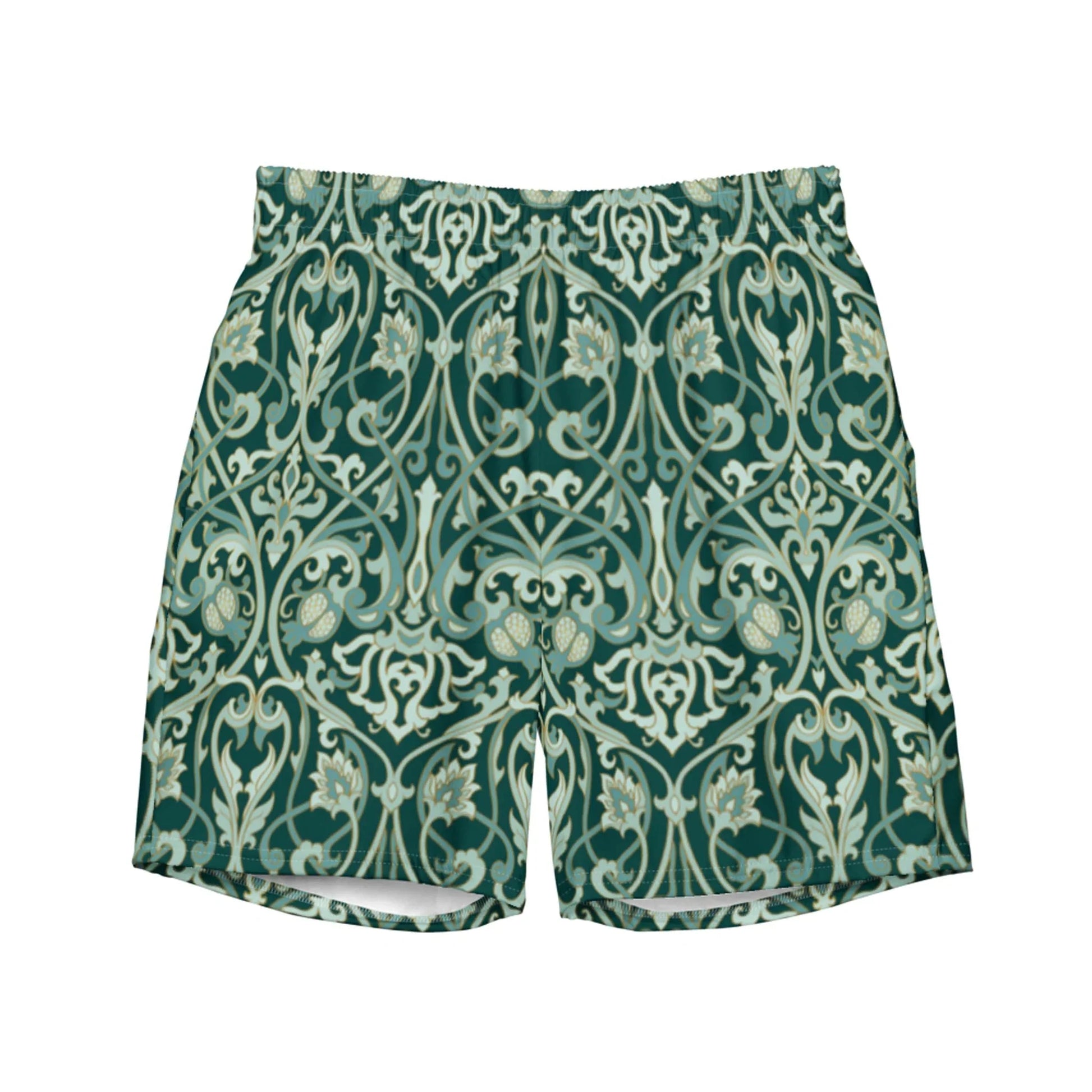 The Oz Swim Trunks by Printful feature an ornate, symmetrical vintage floral pattern in green and cream, with stylized vines and flowers. Made from water-repellent fabric for comfort in and out of the water.