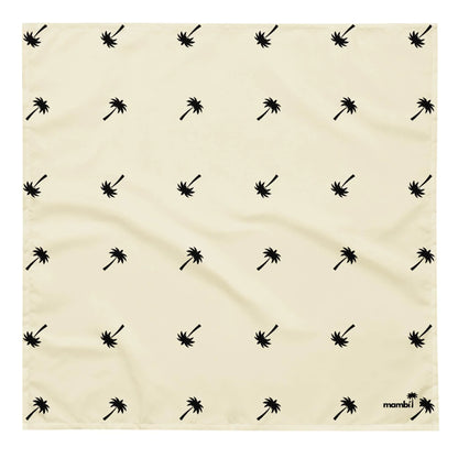 A cream-colored square cloth with a repeating pattern of small black palm trees evenly spaced. The word Mambí is printed in black in the lower right corner.