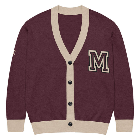 A maroon unisex sweater cardigan with beige trim, black buttons, and a large beige letter M patch on the left chest. Features a beige stripe detail on the right sleeve in a lightweight knit perfect for layering.