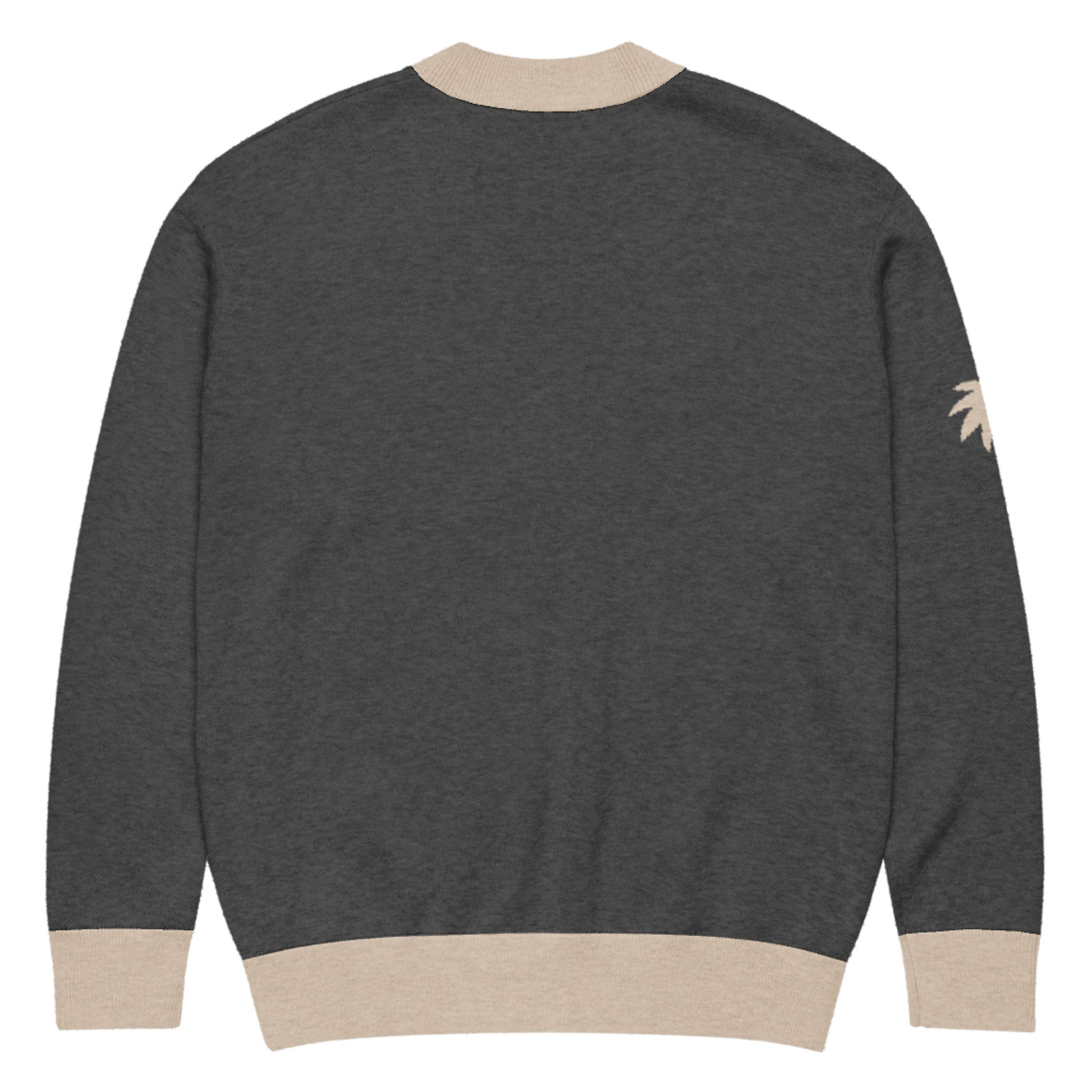 A dark gray two-tone cardigan with light beige ribbed cuffs, hem, and collar. Shown from the back, this unisex cardigan features a small, light beige palm tree design on the upper left sleeve.