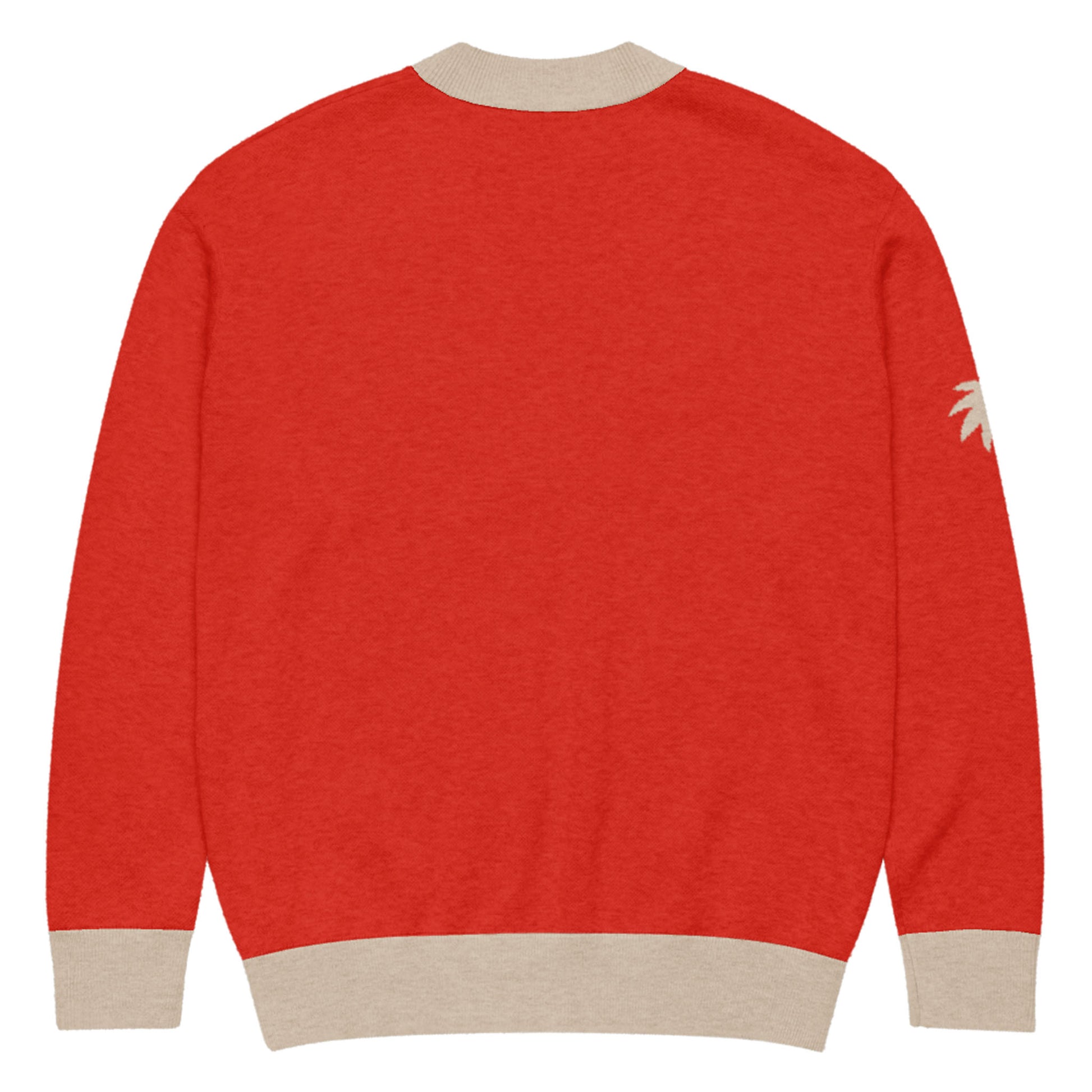 A red two-tone cardigan with beige ribbed cuffs, collar, and hem, shown from the back. A small beige palm tree design accents the upper right sleeve for a subtle touch.