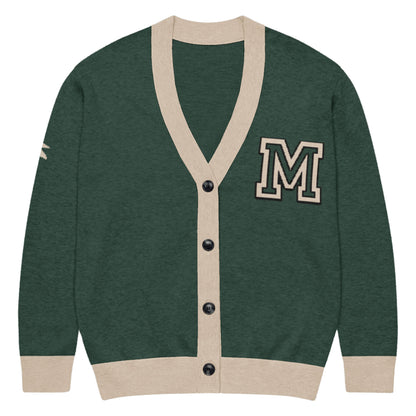 A stylish two-tone cardigan in Pine & Taupe with black buttons and a bold taupe letter M patch on the chest, plus a taupe stripe on the right sleeve for added flair.