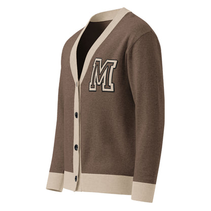 A two-tone cardigan in brown with cream trim on the collar, cuffs, and hem, featuring black buttons and a large letter M patch on the left chest.