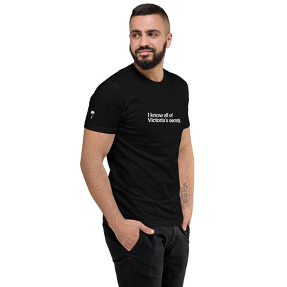 Man wearing a black t-shirt with text on a white background