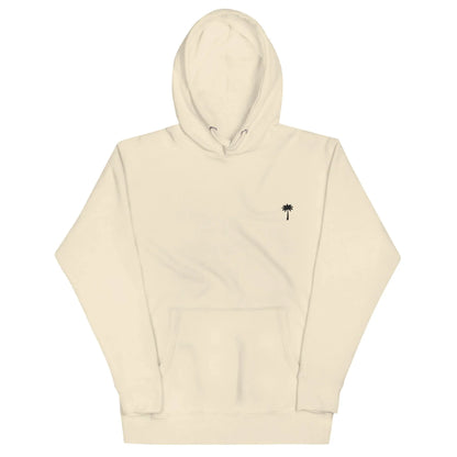 Beige Mambí hooded sweatshirt with a front pocket and a small black palm tree graphic on the left chest.