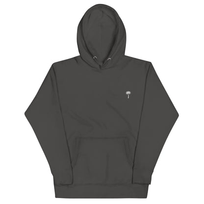 A dark gray Mambí hooded sweatshirt featuring a small white palm tree graphic on the left chest and a front kangaroo pocket, displayed on a white background.