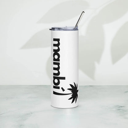A tall white tumbler with a metal straw and clear lid, featuring the word Mambí in bold black letters and a palm tree graphic, stands on a light surface with a leaf shadow in the background.