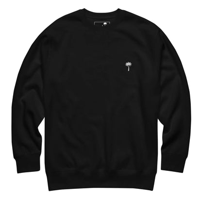 A plain black Mambí crewneck sweatshirt with a small white palm tree logo on the left chest area, displayed on a white background.