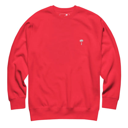 Bright red crewneck sweatshirt with long sleeves, featuring a small embroidered palm tree design and subtle Mambí detail on the left chest. The sweatshirt is laid flat on a white background.