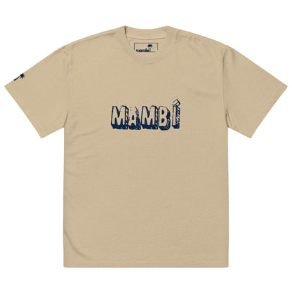 Beige t-shirt featuring MAMBÍ in bold, distressed navy blue letters across the chest, with a small logo on the left sleeve and an inner neck tag.
