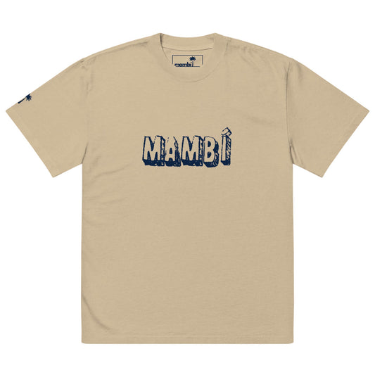 Beige t-shirt featuring MAMBÍ in bold, distressed navy blue letters across the chest, with a small logo on the left sleeve and an inner neck tag.