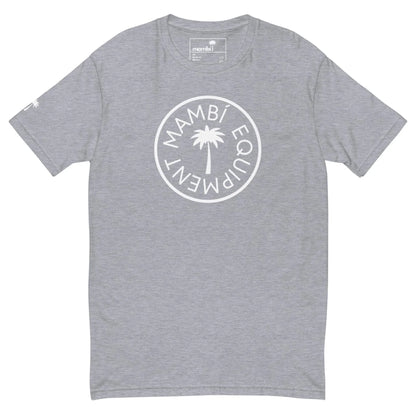 Light gray short-sleeve t-shirt with a white circular Mambí EQUIPMENT logo around a palm tree graphic on the chest. Features a brand tag inside the collar and a small palm logo on the right sleeve.