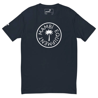 A navy blue t-shirt featuring a white circular logo with a palm tree in the center and the words Mambí Equipment around it. The left sleeve is accented with a small white palm tree graphic.