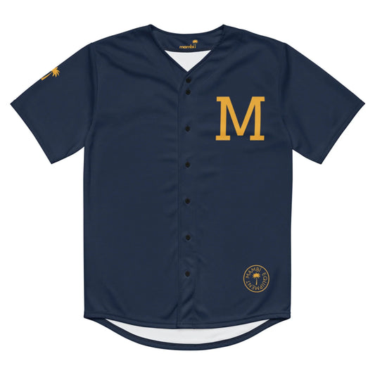 The Zoilo Classic Baseball Jersey by Printful features navy blue fabric with gold accents, a bold gold M on the left chest, a small circular logo at the hem, a functional gold emblem on the right sleeve, and black buttons. Unisex design.